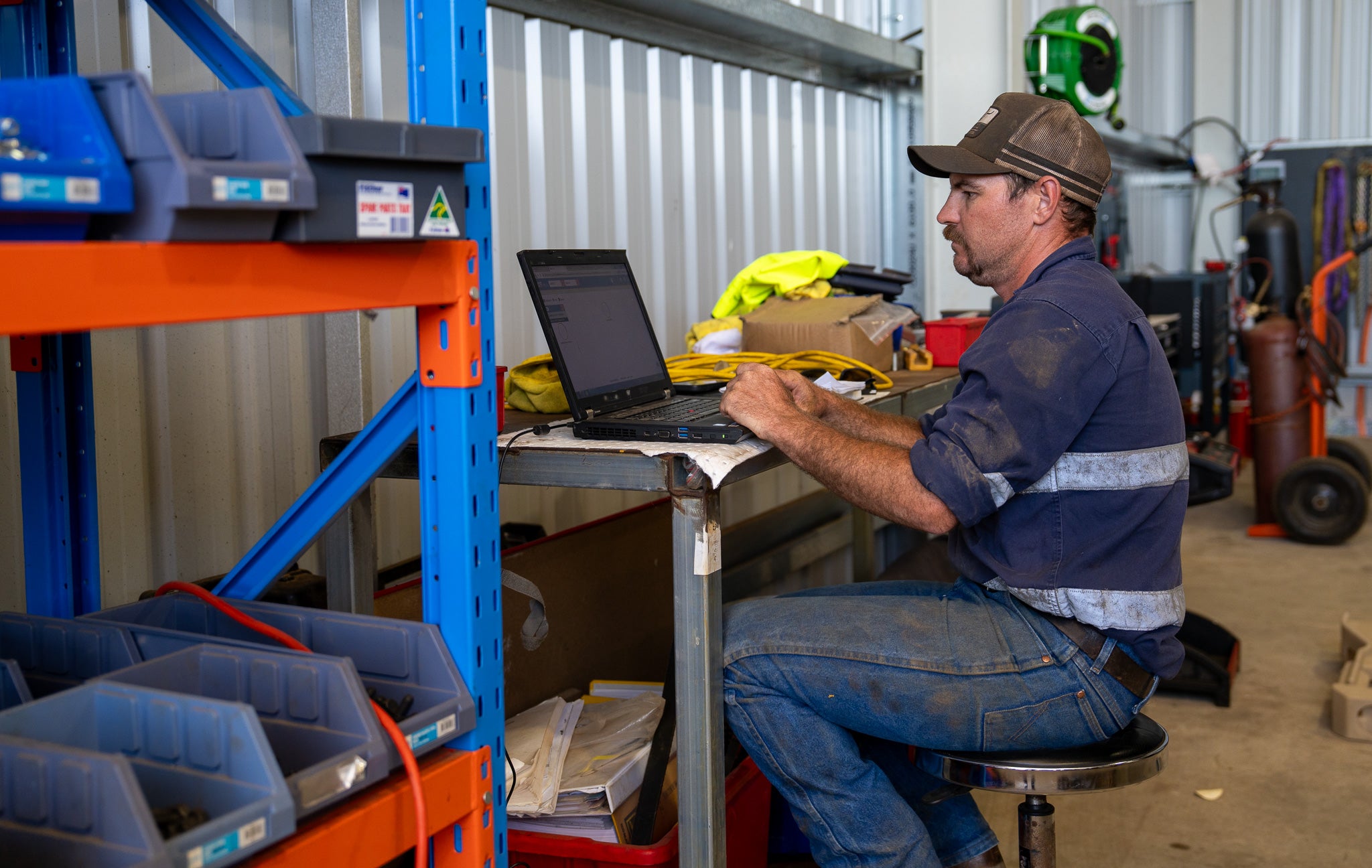 Hands-on mechanical work inside the Capital Equipment Sales workshop